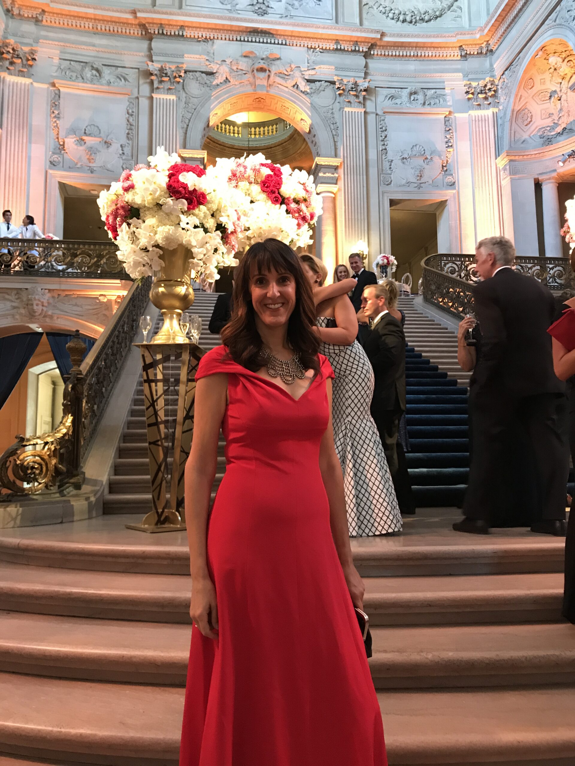 Jenny Bailey Stylist wearing a red dress